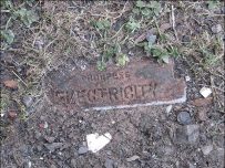 A brick with the words 'phorpres electricity' A brick with the words 'phorpres electricity'