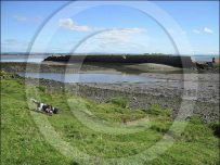 Remains of the harbour wall at Port Carlisle Remains of the harbour wall at Port Carlisle