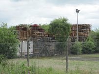 Wooden pallets stacked almost to the sky Wooden pallets stacked almost to the sky
