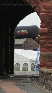 Just visible through the arch is a large tent and publicity arch